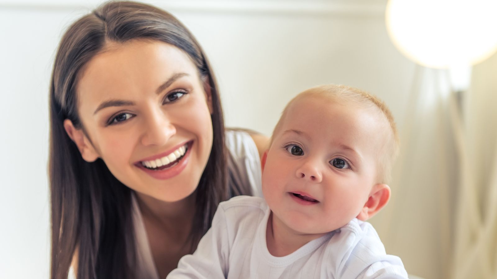 Healthy Start mom and cute baby smiling