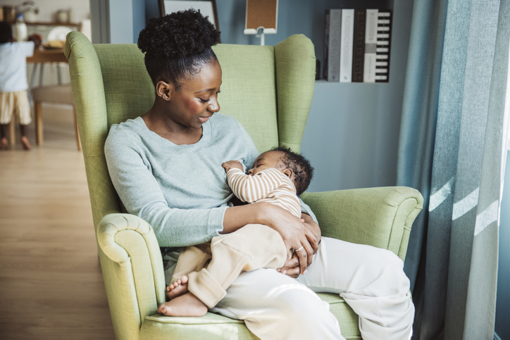 Woman breastfeeding infant